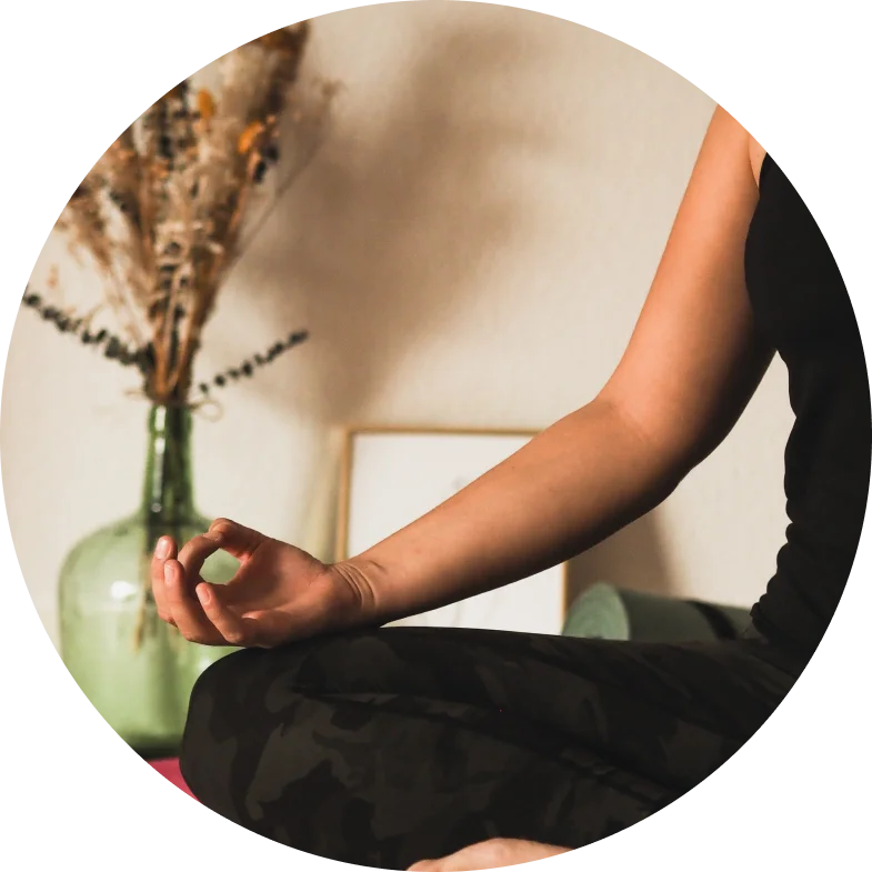 Peaceful sitting yoga pose. Arm resting on the leg.